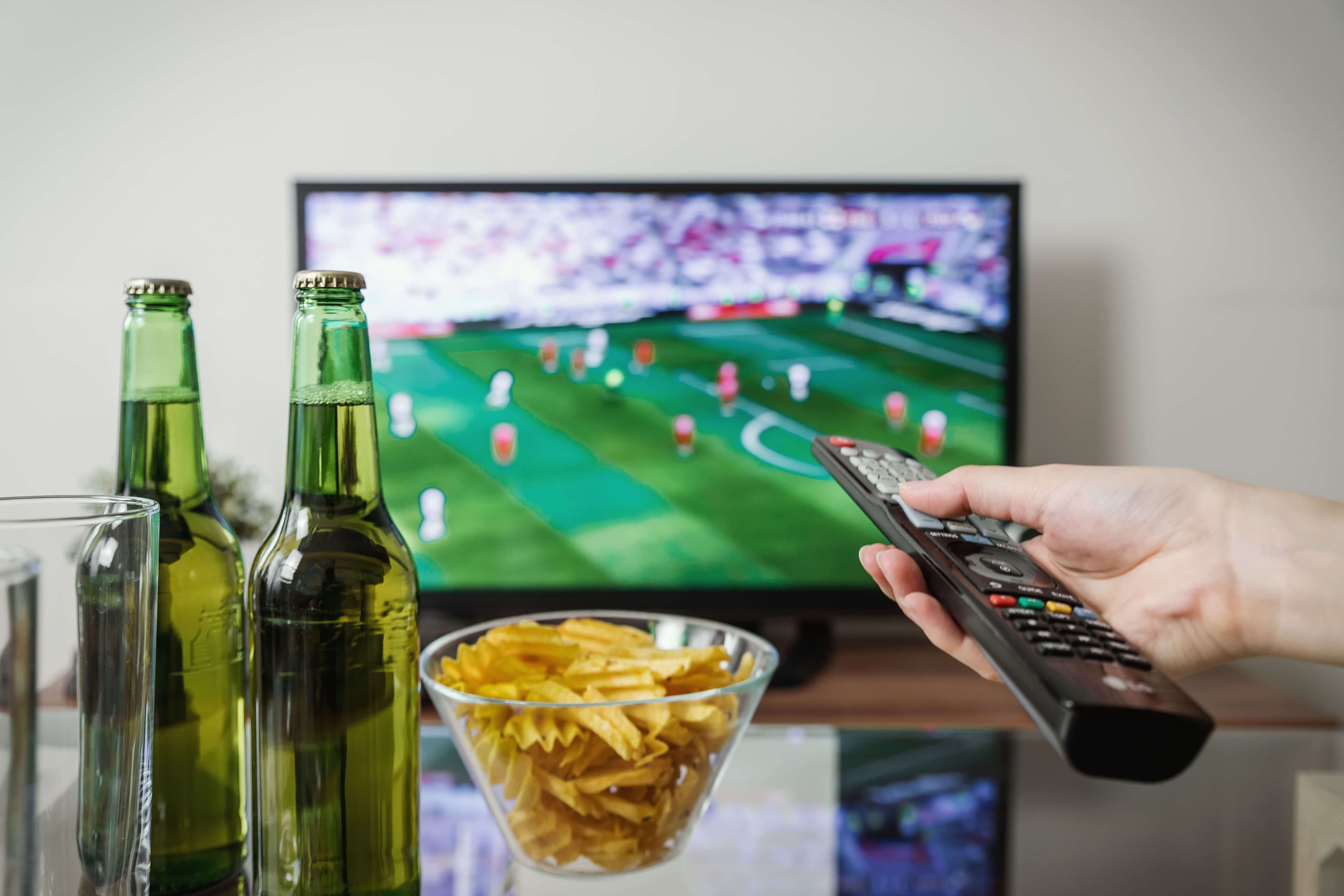 Live TV channel guide next to an on-demand movie library on an IPTV USA service